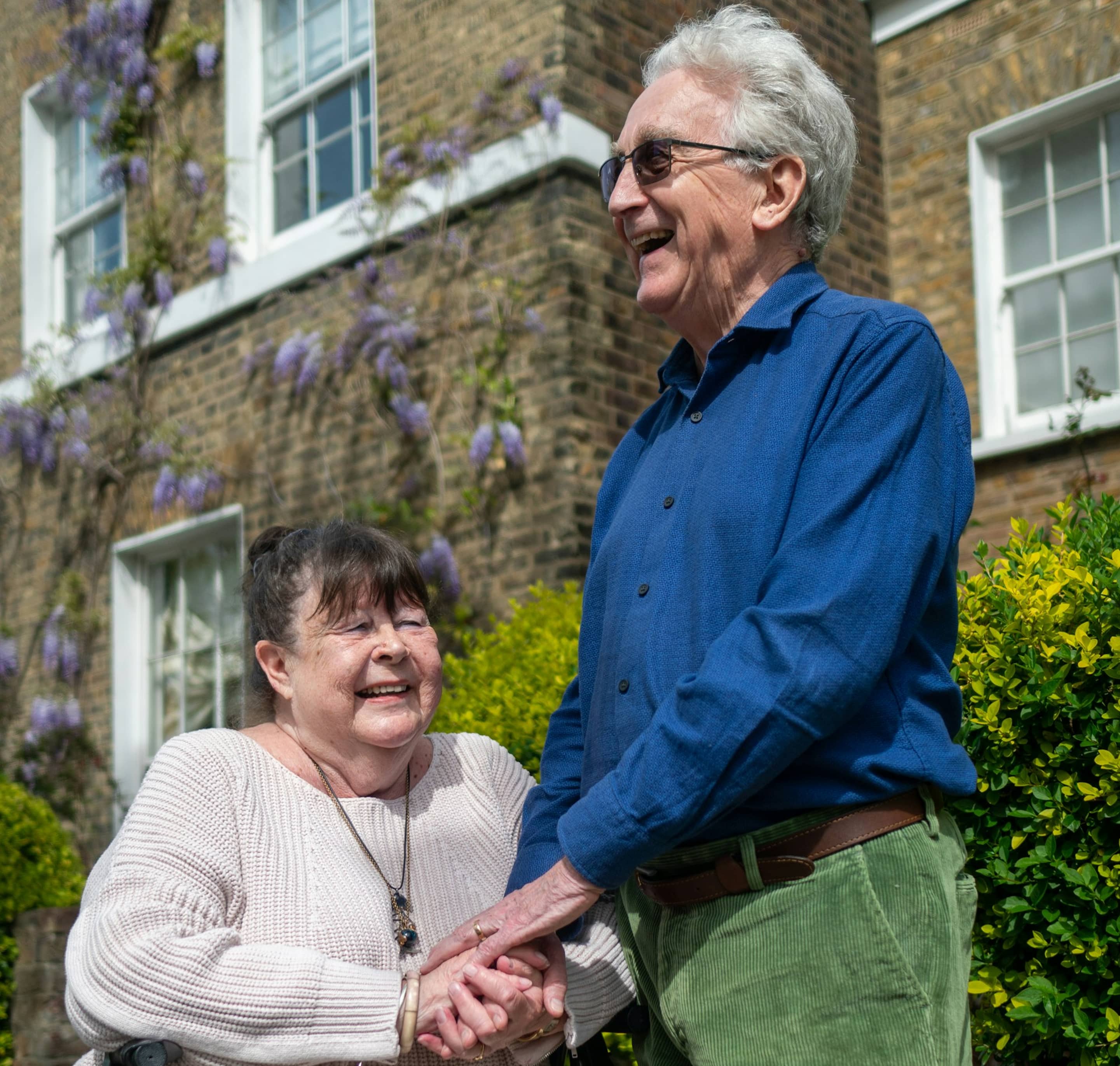 Two people sharing a warm outdoor moment